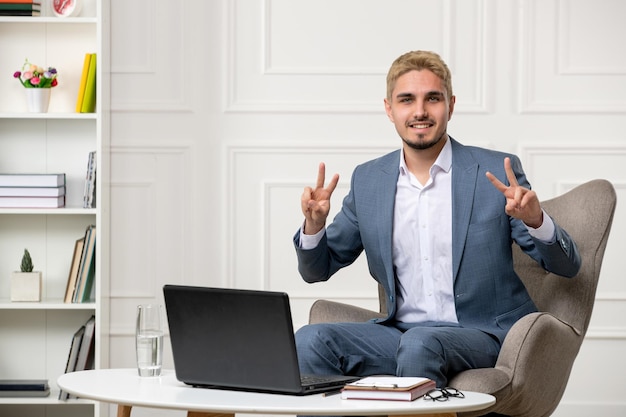 Psychologist running online sessions cute handsome young professional guy showing peace sign