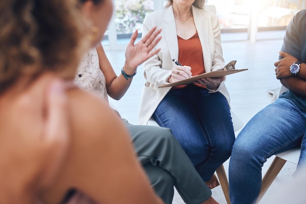 Photo psychologist therapy group support writing notes stress anxiety and empathy listening to patient speaking mental health grief counseling psychology mind wellness and therapist communication help