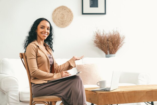 Psychologist woman in clinic office professional portrait with friendly smile feeling inviting for patient to visit the psychologist the experienced and confident psychologist is crucial specialist