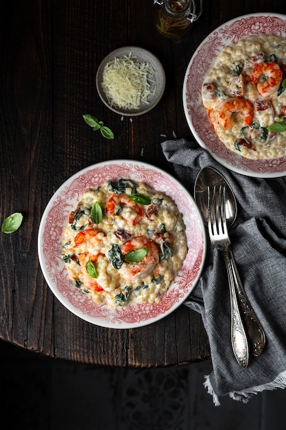 Ptitim pasta with shrimp, dried tomatoes, spinach