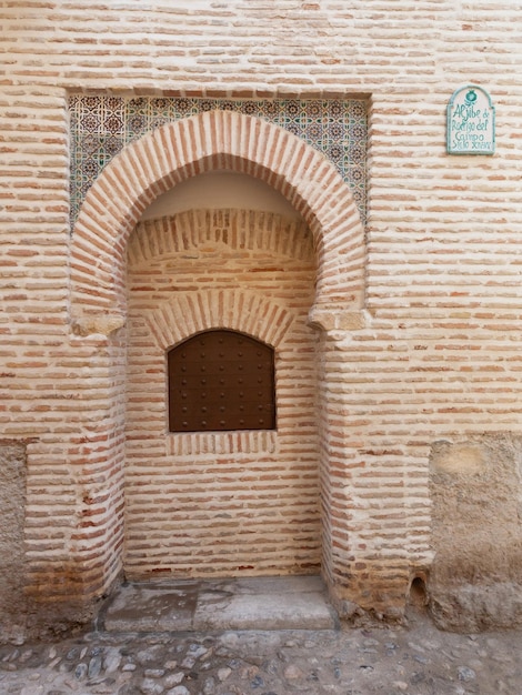 Public pillar facade in the streets of Granada