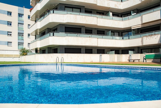 Public pool in an apartment complex at the height of\
summer