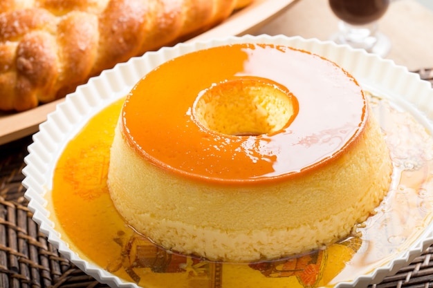 Pudding of condensed milk with caramel syrup and sweet bread