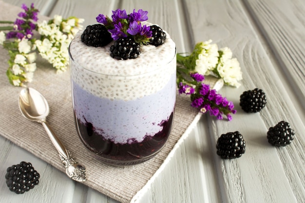 Pudding with chia  and  blackberry  on the grey  napkin