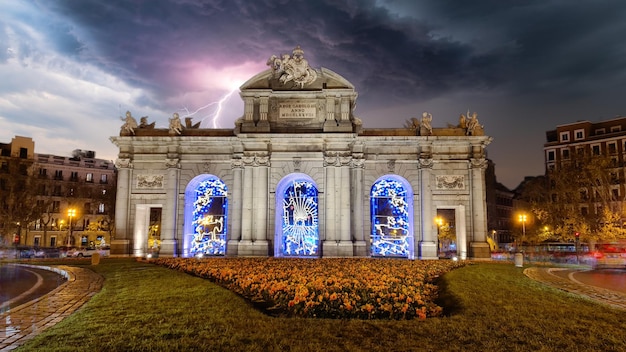 Puerta de Alcala, in the center of Madrid, with a thunderstorm in the background. Tourism in Madrid