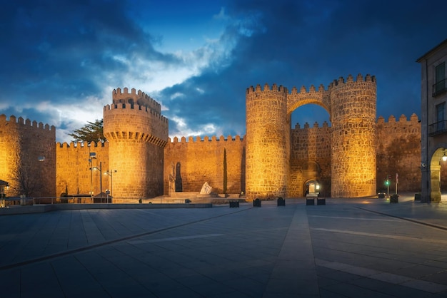 Puerta del Alcazar Gate and Torre del Homenage Keep of Medieval Walls of Avila at night Avila SpainxA