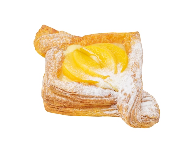 Puff pastry baked sweet with pieces peaches cream and powdered sugar isolated on white background with clipping path