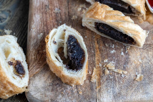 Puff pastry bun made of wheat dough and poppy seed filling