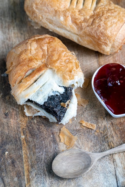 Puff pastry bun made of wheat dough and poppy seed filling