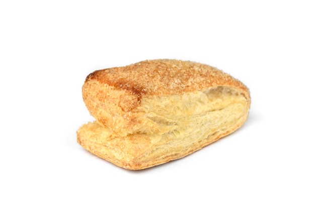 Puff pastry bun (tongue) isolated on white background.