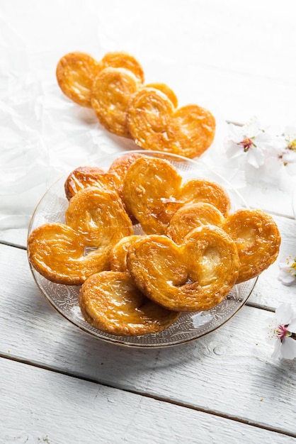 Puff pastry palms with honey Dessert with flour sugar honey egg for breakfast industrial homemade