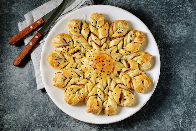 Puff pastry pie with ham and cheese