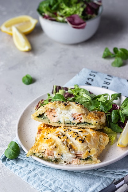 Puff pastry pie with salmon, spinach and ricotta Salmon Wellington in puff pastry