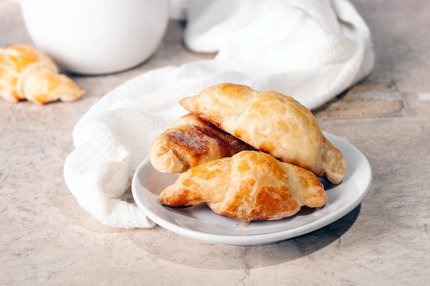 Puff pastry pies on a white ceramic plate