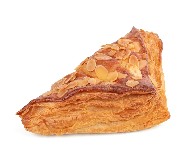 Puff pastry with almonds on a white background