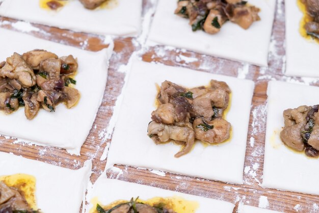 Puff pastry with chicken preparing for baking