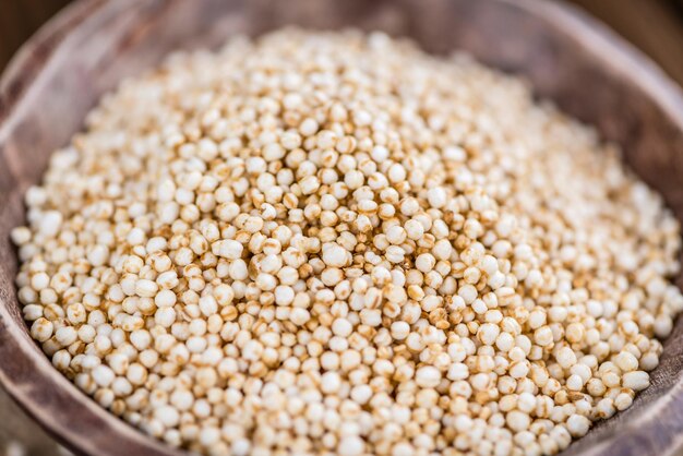 Puffed Quinoa selective focus closeup shot on wooden background