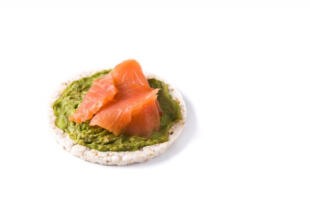 Puffed rice cake with guacamole and salmon