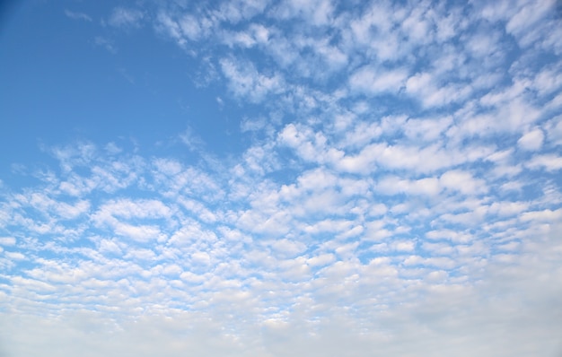 Puffy Clouds on blue sky background.