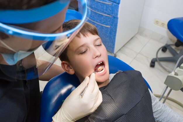 Pulling out a tooth done by a professional dentist doctor