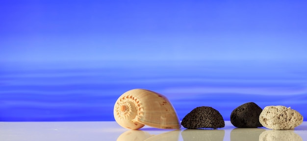 Pumice rocks on blue sea background