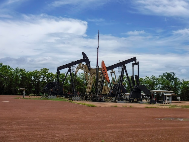 Photo pump jack starting the lifting stroke to brink crude oil up out of a producing oil well.