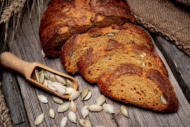 Pumpkin bread. Freshly baked traditional bread on wooden table.