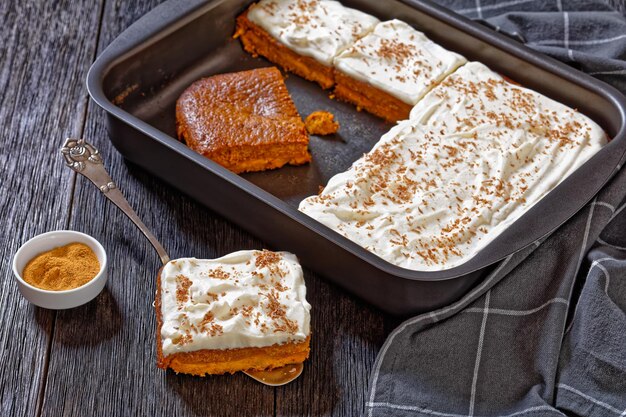 Pumpkin cake with cream frosting top view