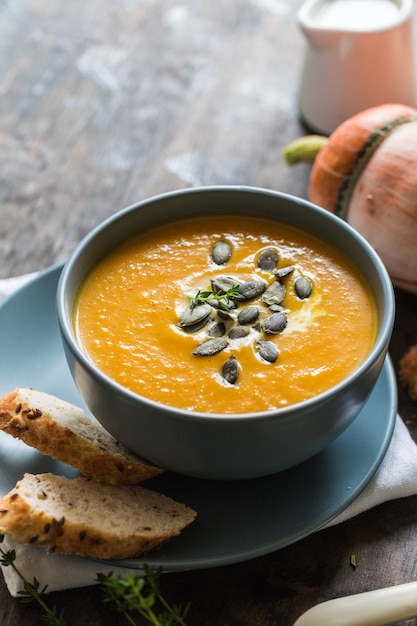 Pumpkin and carrot cream soup with seeds