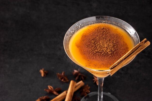 Pumpkin cocktail on a wooden table