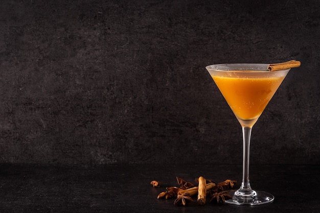 Pumpkin cocktail on a wooden table