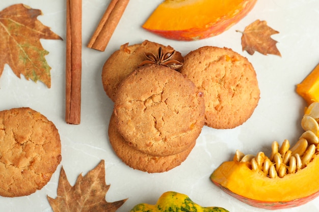 Photo pumpkin cookies on white textured background, top view.