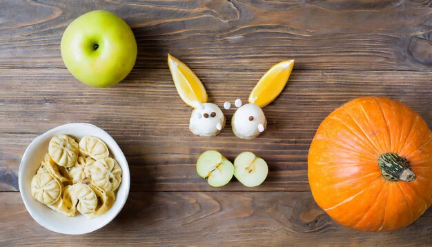 Photo pumpkin and corn isolated on wood background