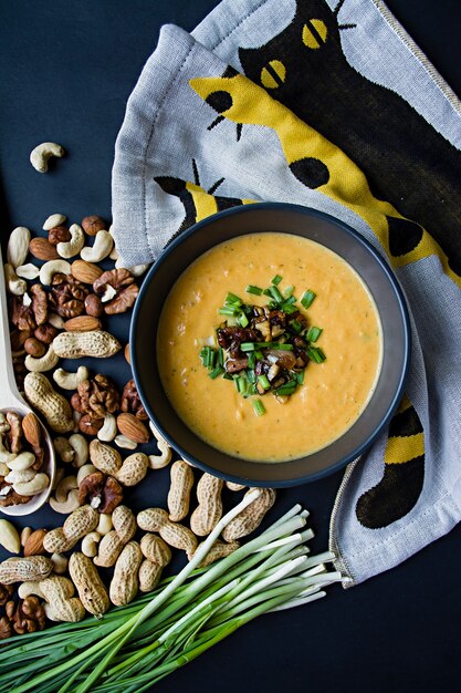 Pumpkin cream soup. Dark background.