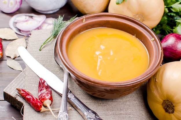 Pumpkin cream soup with pumpkin seeds  in bowl 