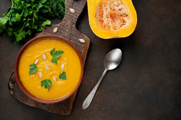 Pumpkin cream soup with seeds and herbs. healthy food 