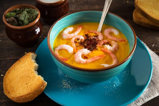 Pumpkin cream soup with shrimps