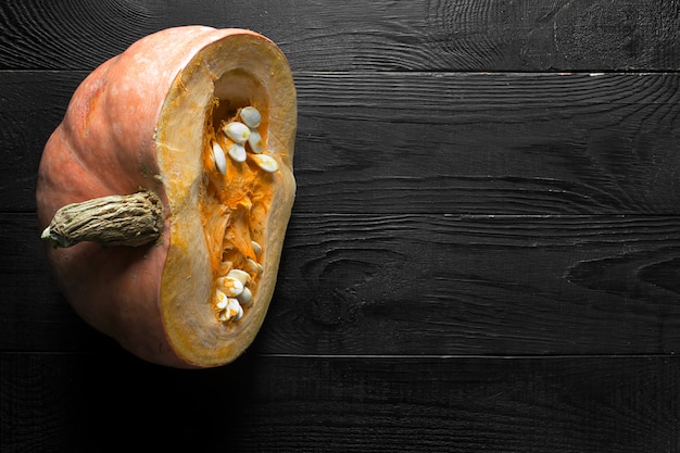 Pumpkin on the dark wooden table