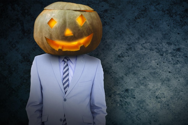 Pumpkin head businessman with copy space