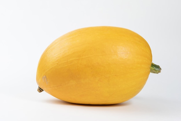 Pumpkin isolated on white with shadow and subtle reflection. Ripe ugly pumpkin, orange pumpkin. Harvest.