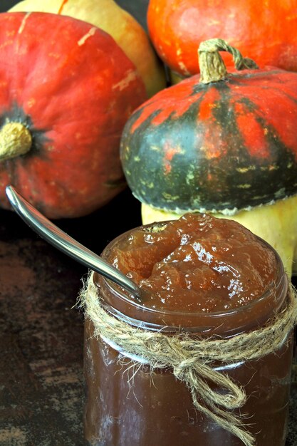 Photo pumpkin jam and pumpkins. useful and tasty pumpkin marmalade.