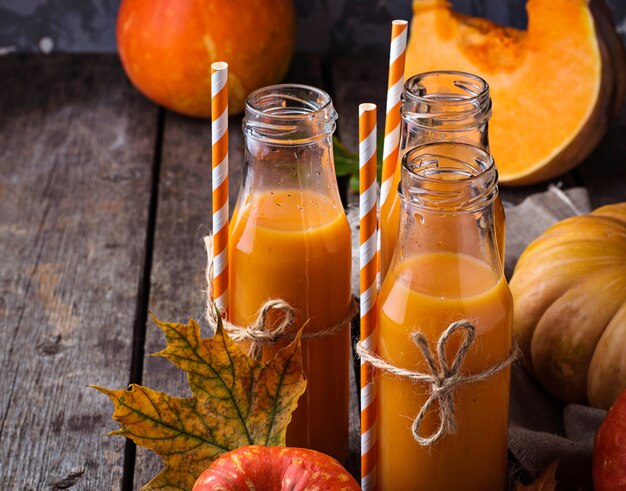 Pumpkin juice in bottles. Autumn healthy drink