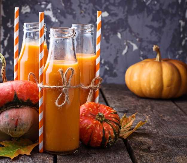 Pumpkin juice in bottles. Autumn healthy drink