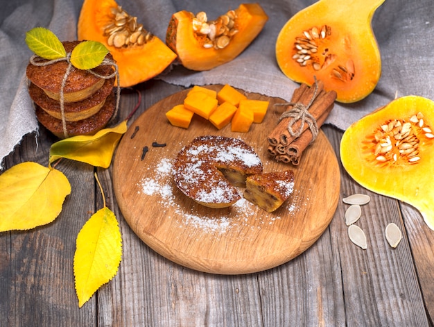 Pumpkin muffins and fresh pumpkin 