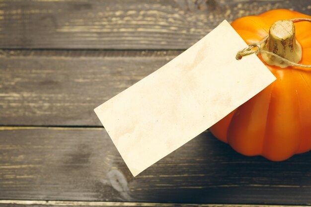 Pumpkin on old rustic wooden table.