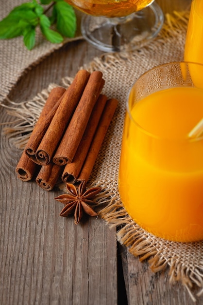 Pumpkin and orange spiced fall cocktail with cinnamon