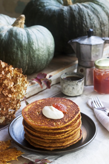 Pumpkin pancakes with cream and jam