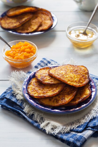 Pumpkin pancakes with honey and tea