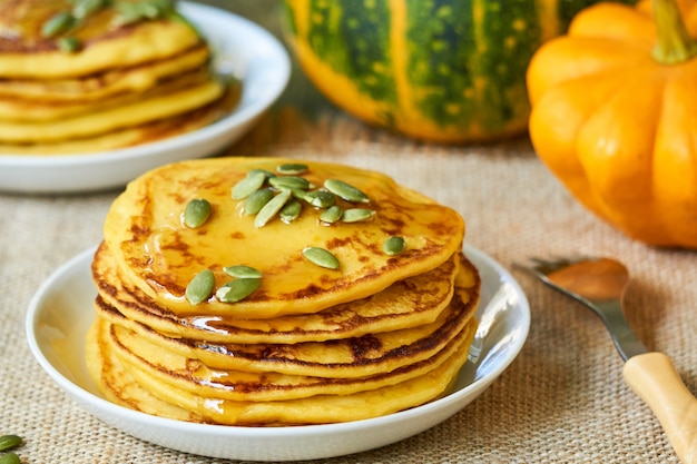 Pumpkin pancakes with seeds and honey