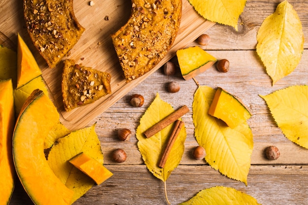 Pumpkin pancakes on a wooden background. Autumn food